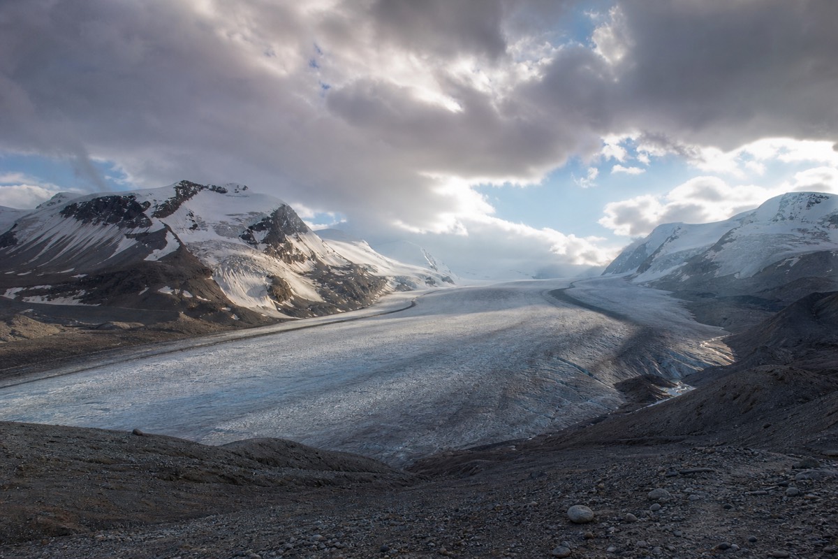Changeable mountain weather with low cloud drifting over the Columbia Icefield and Athabasca Glacier